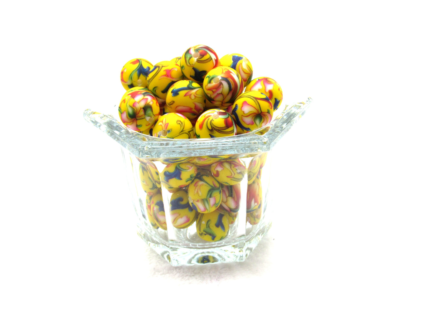 Prints on a yellow 15mm bead in a colorful vine design