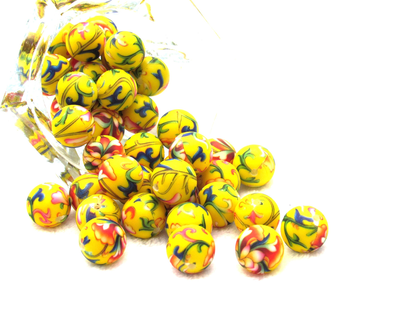Prints on a yellow 15mm bead in a colorful vine design