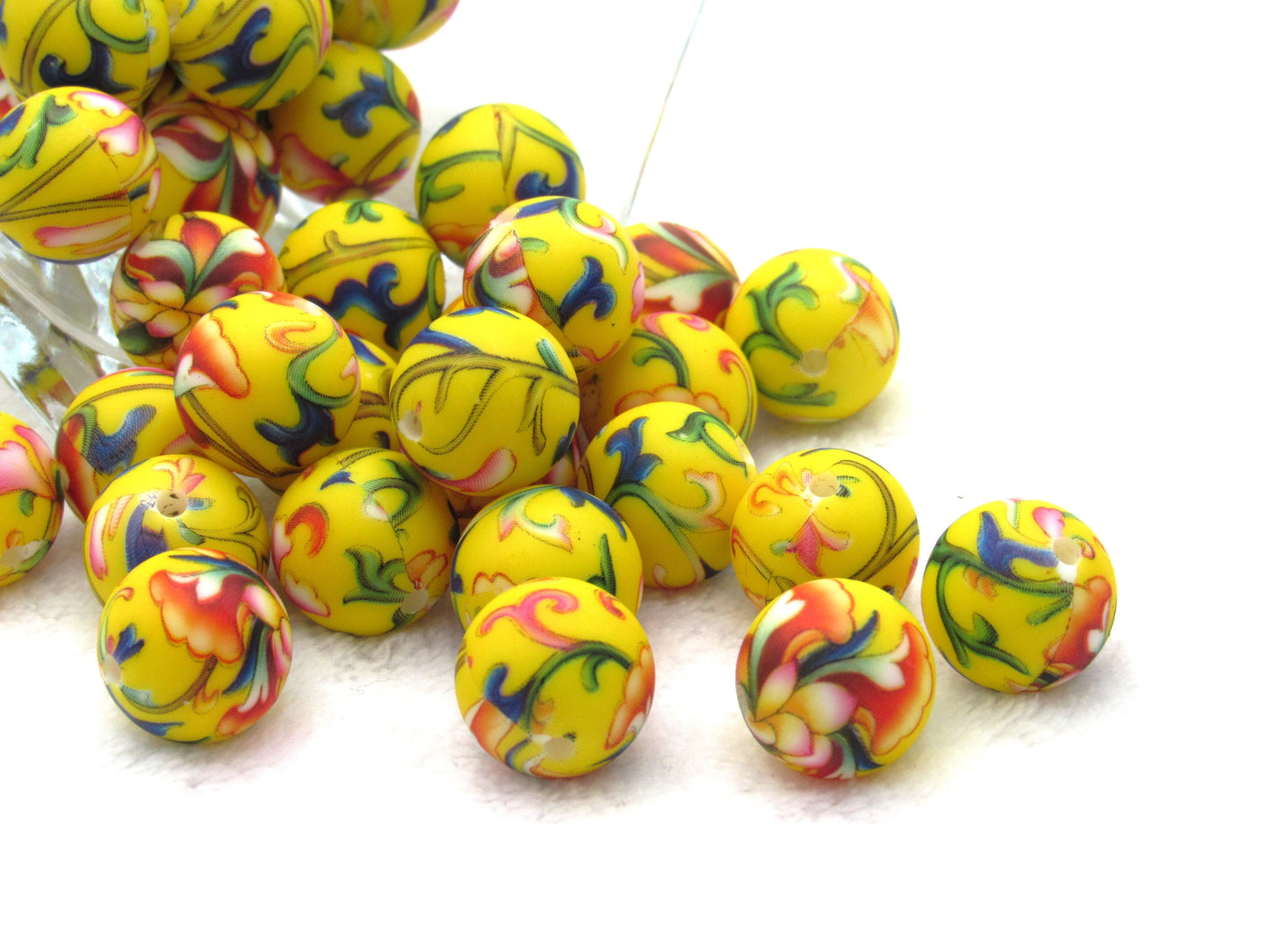 Prints on a yellow 15mm bead in a colorful vine design