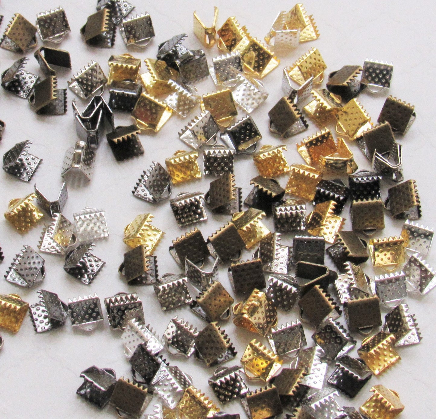 10 Ct. Iron Ribbon Ends, Crimp Clasps, Suede Cord Clasps, Ribbon Necklaces, Mixed Color Size: About 6mm Wide 6mm Long