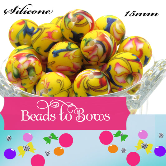 Prints on a yellow 15mm bead in a colorful vine design