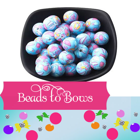Silicone Prints blue and pink seashore print in a colorful designs